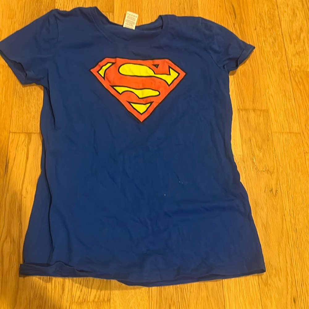 woman's blue superman shirt